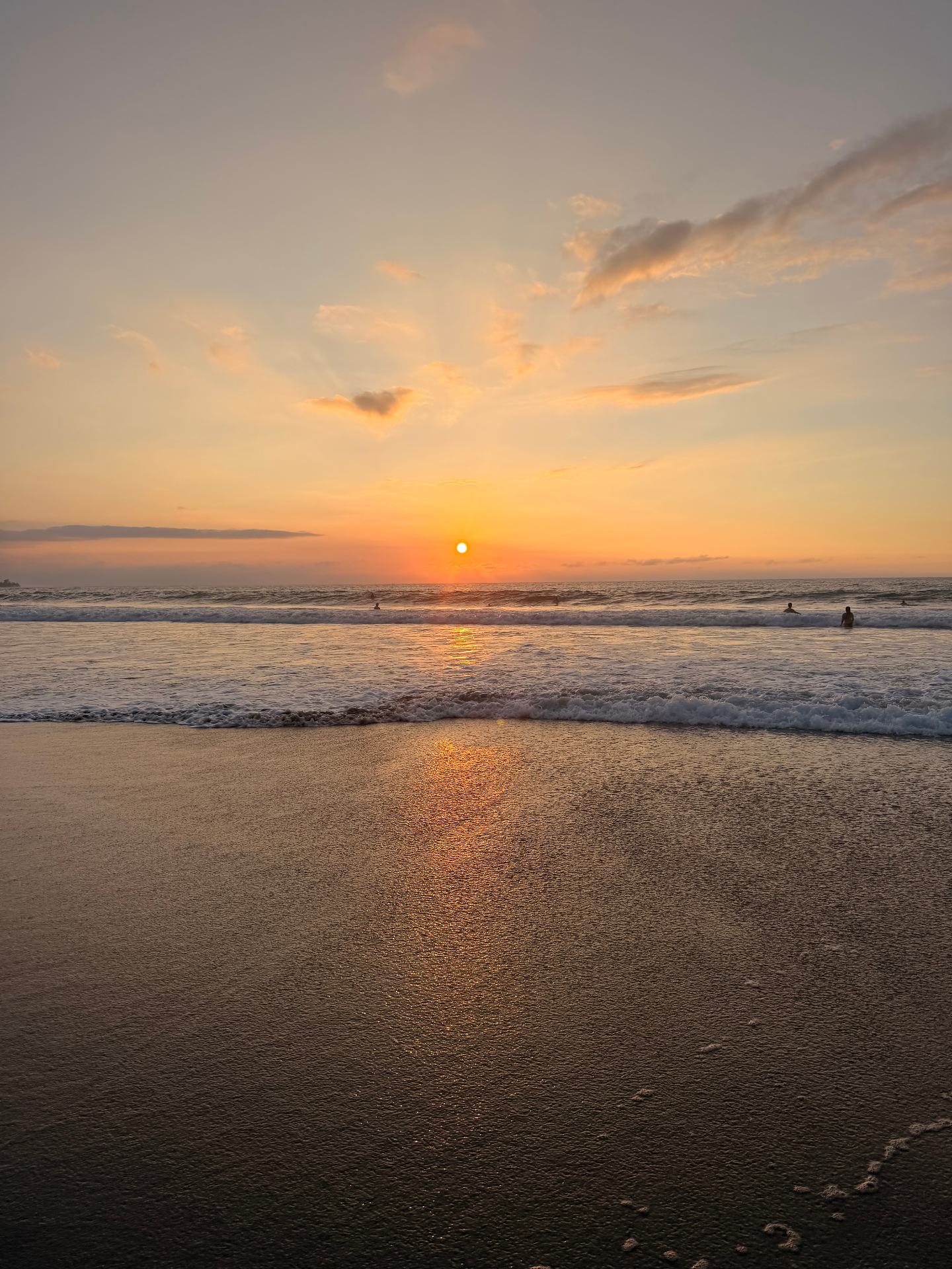 Sunset over the ocean at a Hawaiʻi beach